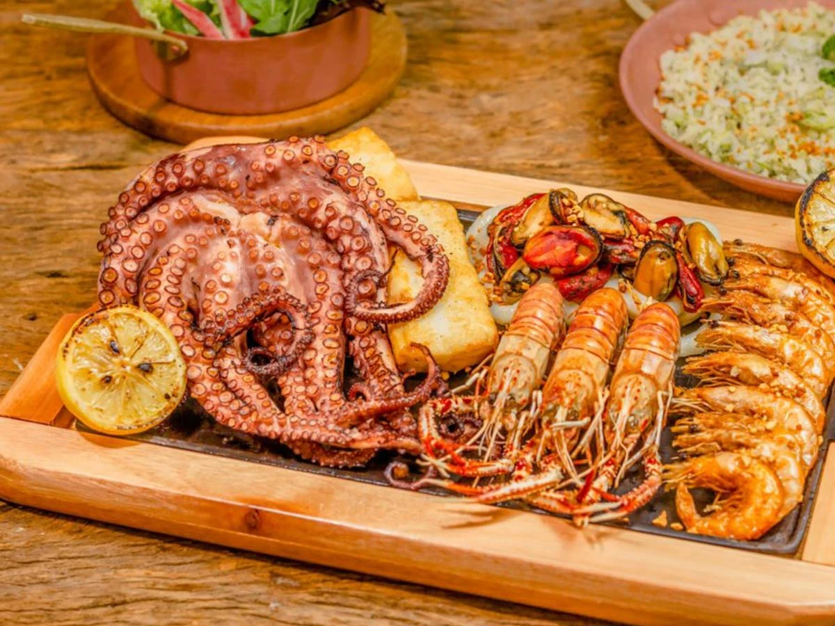 A delicious platter of grilled octopus and shrimp served at a local Brazilian seafood restaurant, showcasing regional cuisine.
