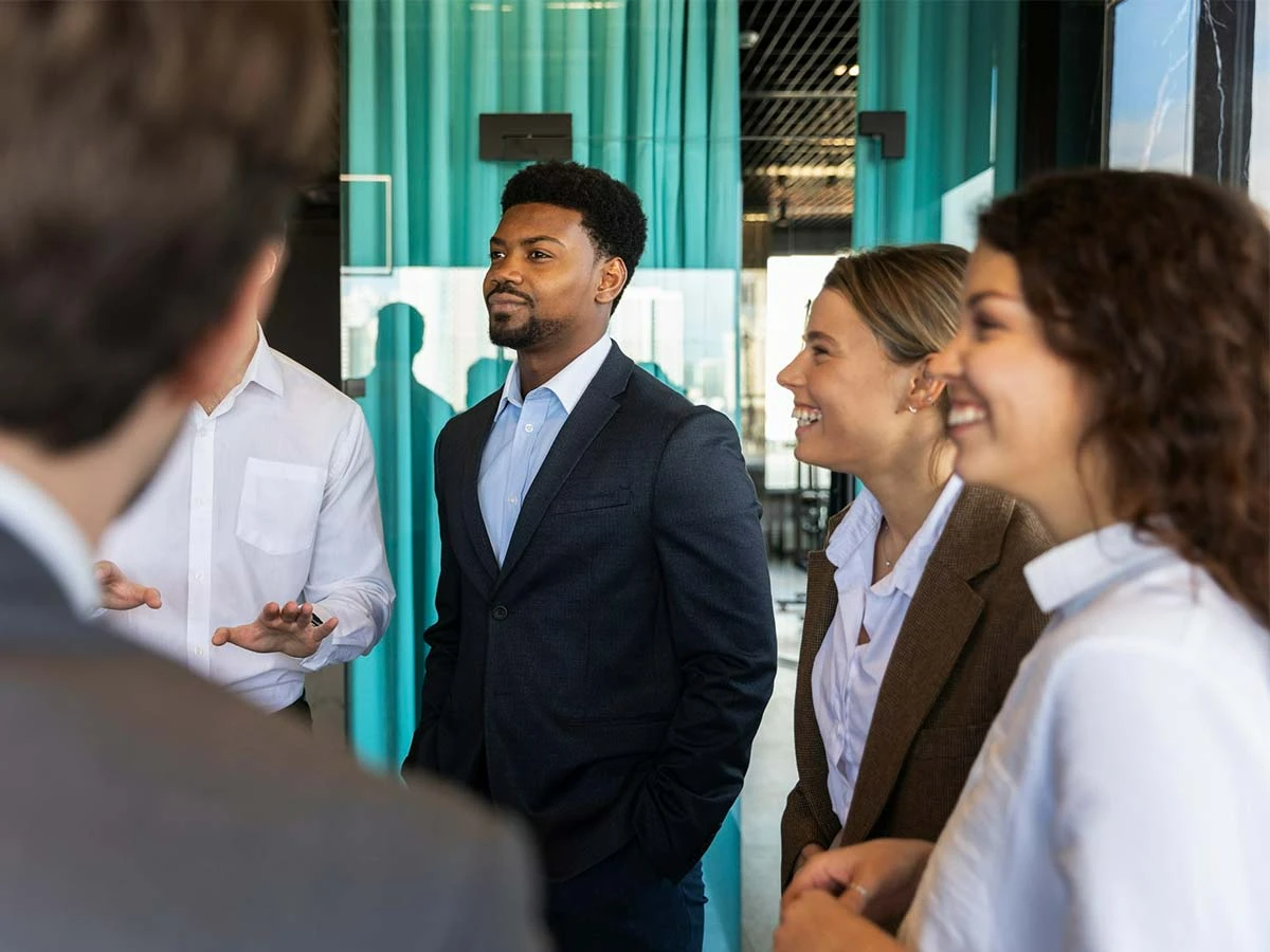 A group of professionals chatting at an American expat networking event in Brazil, representing the local international community.
